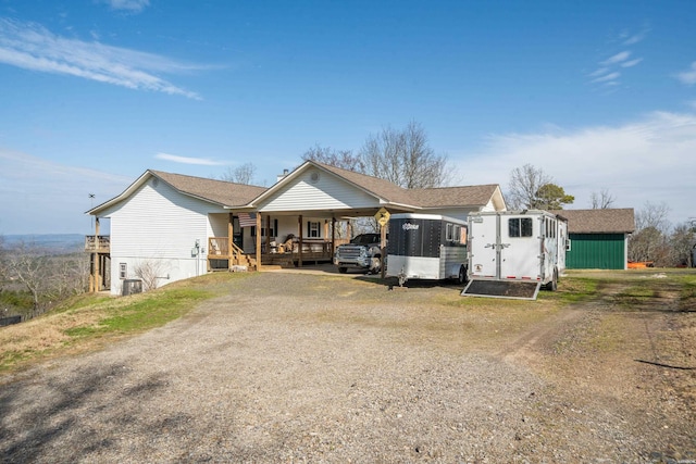 view of front of house featuring a porch and driveway