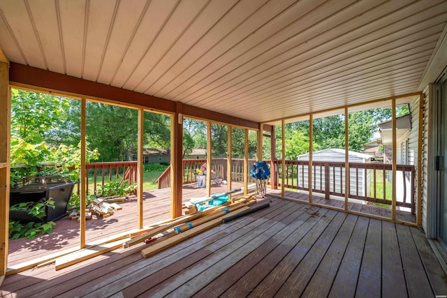 unfurnished sunroom featuring a wealth of natural light