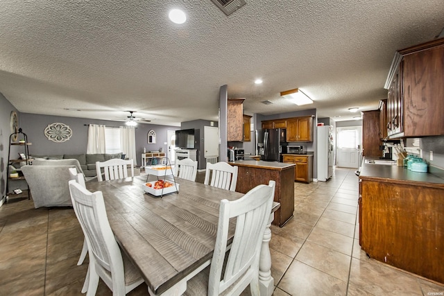 2939 Finch Rd, Bismarck, AR 71929 - dining room with ceiling fan, a textured ceiling, light tile patterned flooring, and recessed lighting