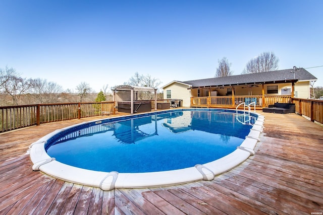 2939 Finch Rd, Bismarck, AR 71929 - view of swimming pool with a deck, a covered hot tub, and an outdoor hangout area