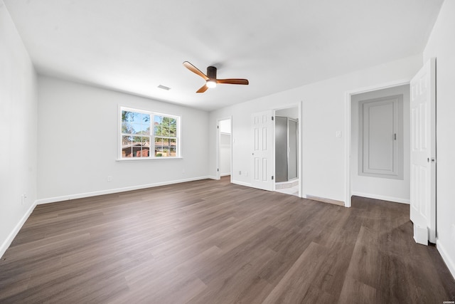 unfurnished bedroom featuring ceiling fan, visible vents, baseboards, and dark wood-style flooring