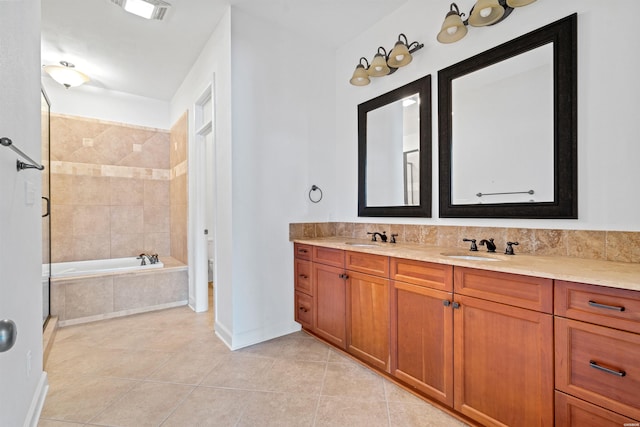 full bathroom featuring double vanity, a garden tub, a sink, and tile patterned floors