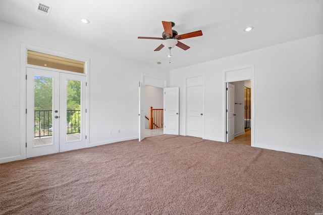 unfurnished bedroom with recessed lighting, light carpet, visible vents, access to outside, and french doors