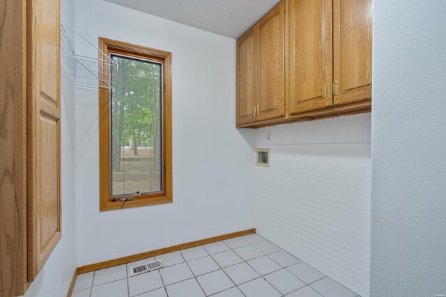 111 Black Oak Ct, Hot Springs, AR 71913 - washroom with cabinet space, washer hookup, and light tile patterned floors