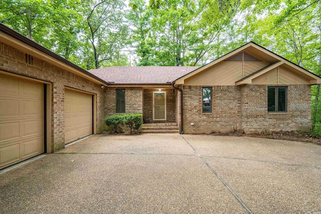 111 Black Oak Ct, Hot Springs, AR 71913 - view of front of home with concrete driveway, brick siding, a garage, and roof with shingles