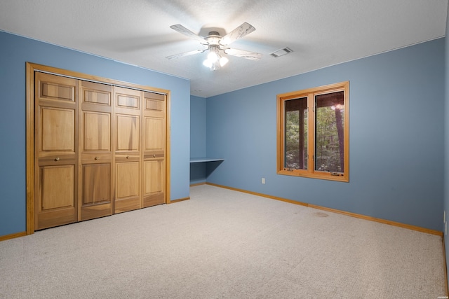 111 Black Oak Ct, Hot Springs, AR 71913 - unfurnished bedroom featuring carpet flooring, a closet, a ceiling fan, and a textured ceiling