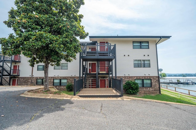 5371 Central Ave Unit 6G, Hot Springs, AR 71913 - townhome / multi-family property with stairs, brick siding, a water view, and a balcony