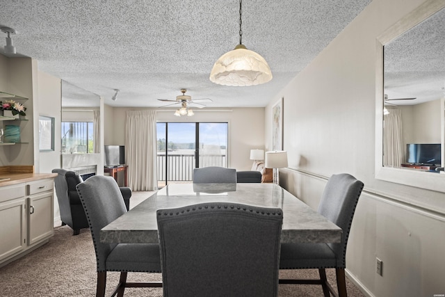 5371 Central Ave Unit 6G, Hot Springs, AR 71913 - dining space with a ceiling fan, a textured ceiling, and carpet flooring