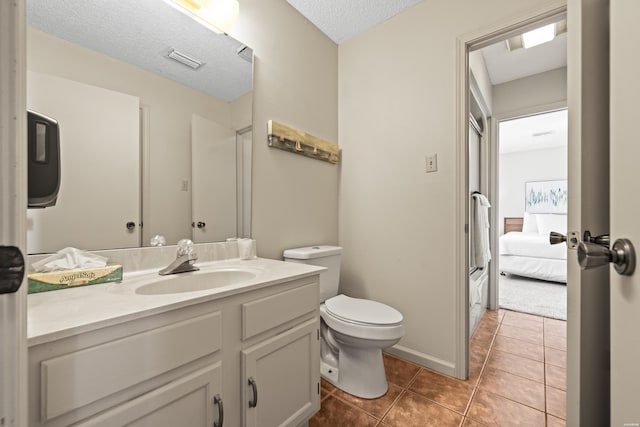 5371 Central Ave Unit 6G, Hot Springs, AR 71913 - bathroom with vanity, tile patterned flooring, ensuite bath, and a textured ceiling