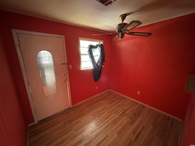 entrance foyer with wood finished floors, visible vents, and a ceiling fan