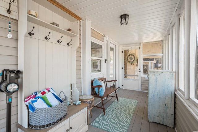 sunroom / solarium featuring wood ceiling