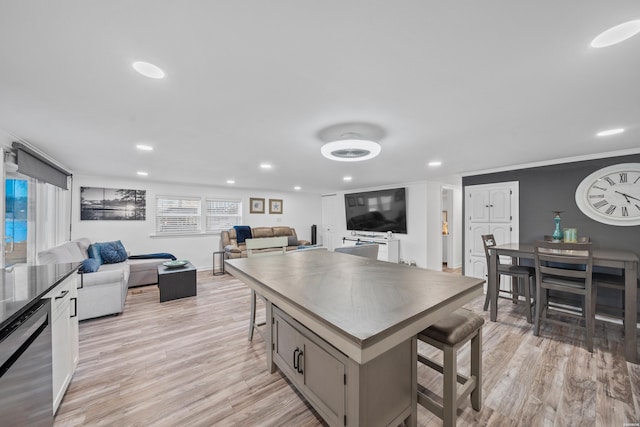 dining area featuring recessed lighting and light wood-style floors