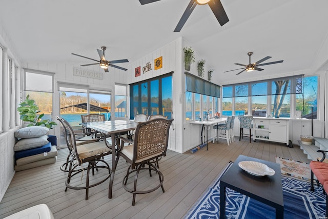 sunroom / solarium featuring a wealth of natural light and ceiling fan