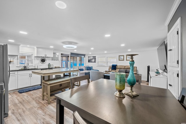 dining area featuring recessed lighting and light wood-style floors