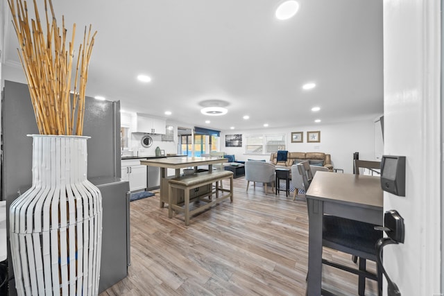 dining area with recessed lighting and light wood-style floors