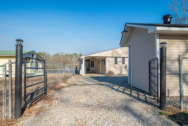 exterior space with fence and a gate