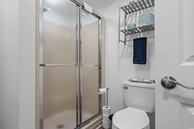 full bathroom with toilet and a stall shower