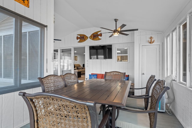 sunroom featuring lofted ceiling and ceiling fan