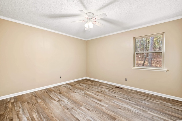 empty room with light wood-type flooring, baseboards, visible vents, and a ceiling fan