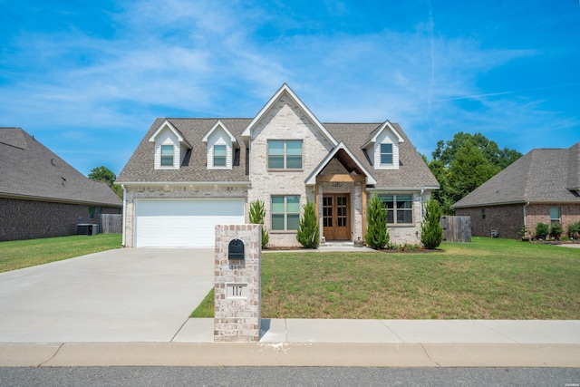 view of front facade featuring central air condition unit, brick siding, a shingled roof, concrete driveway, and a front yard