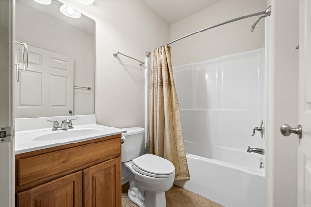 full bathroom with toilet, tile patterned flooring, shower / bathtub combination with curtain, and vanity