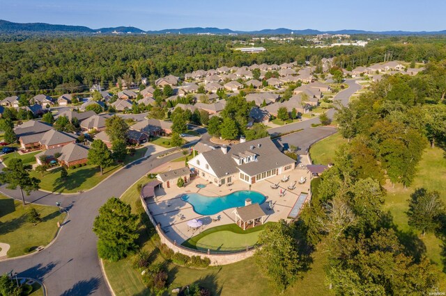 aerial view featuring a mountain view, a residential view, and a view of trees