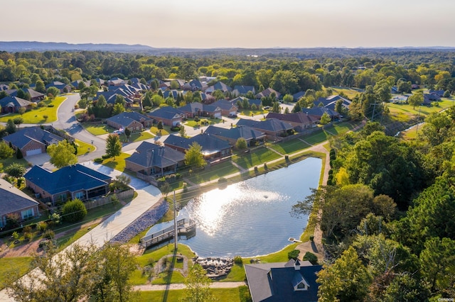 birds eye view of property with a water view and a residential view