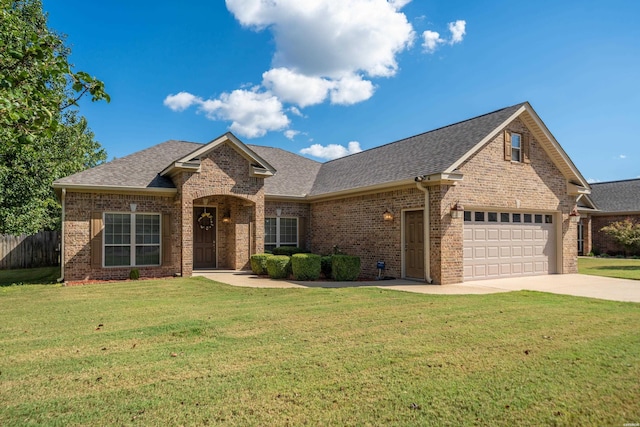 view of front of house featuring a garage, concrete driveway, brick siding, and a front lawn