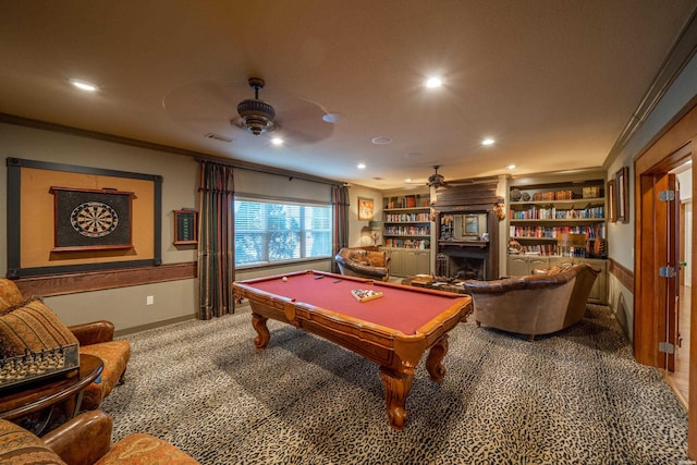 recreation room featuring ceiling fan, crown molding, carpet flooring, a fireplace, and recessed lighting