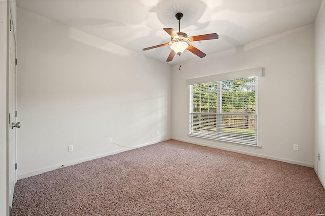 unfurnished room with ceiling fan, carpet flooring, and baseboards