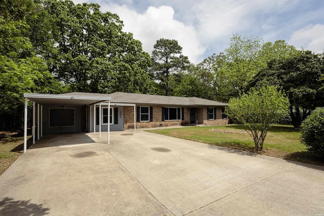 301 Riley St, Hot Springs, AR 71901 - ranch-style home featuring a front lawn, driveway, an attached carport, and brick siding