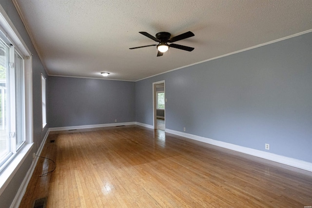 301 Riley St, Hot Springs, AR 71901 - unfurnished room with a textured ceiling, ceiling fan, baseboards, ornamental molding, and wood finished floors
