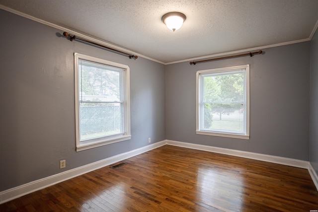 301 Riley St, Hot Springs, AR 71901 - spare room featuring a textured ceiling, visible vents, baseboards, ornamental molding, and wood finished floors