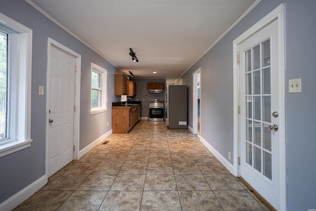 301 Riley St, Hot Springs, AR 71901 - corridor with baseboards, visible vents, crown molding, and a sink