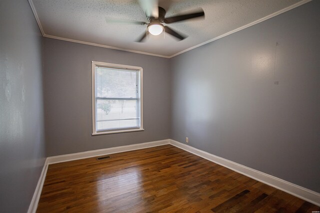 301 Riley St, Hot Springs, AR 71901 - spare room with dark wood-style floors, a ceiling fan, a textured ceiling, and baseboards
