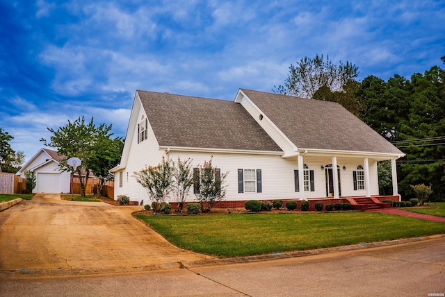 view of front of property with covered porch, a garage, driveway, roof with shingles, and a front lawn