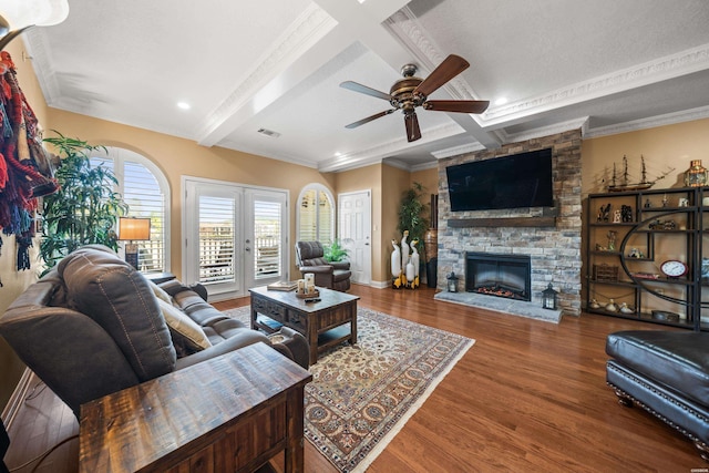 1380 Airport Rd Unit E-1, Hot Springs, AR 71913 - living area with a ceiling fan, beamed ceiling, wood finished floors, ornamental molding, and a fireplace