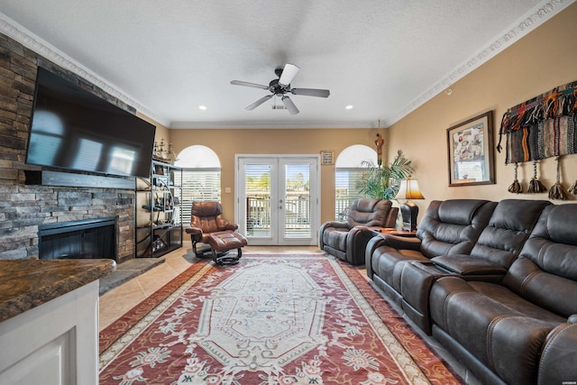 1380 Airport Rd Unit E-1, Hot Springs, AR 71913 - living room featuring a ceiling fan, crown molding, a fireplace, light tile patterned floors, and recessed lighting