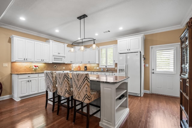 1380 Airport Rd Unit E-1, Hot Springs, AR 71913 - kitchen with white appliances, ornamental molding, a kitchen island, white cabinetry, and open shelves