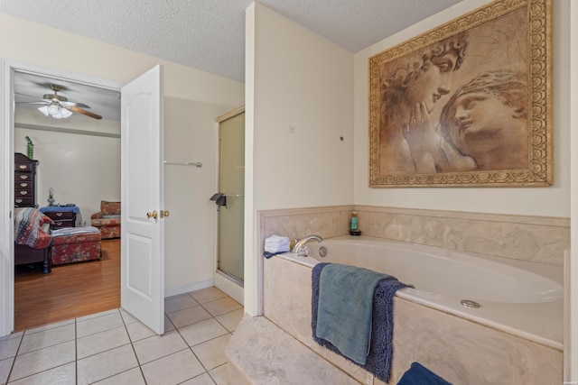 103 Deer View Ct, Hot Springs, AR 71913 - ensuite bathroom with tile patterned flooring, a garden tub, a stall shower, a ceiling fan, and a textured ceiling