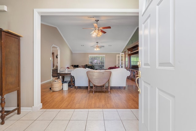 103 Deer View Ct, Hot Springs, AR 71913 - living room featuring vaulted ceiling, ornamental molding, a ceiling fan, arched walkways, and light tile patterned floors