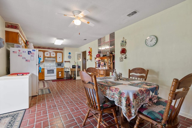 102 Avalon Dr, Pearcy, AR 71964 - dining space featuring brick patterned floors and a ceiling fan