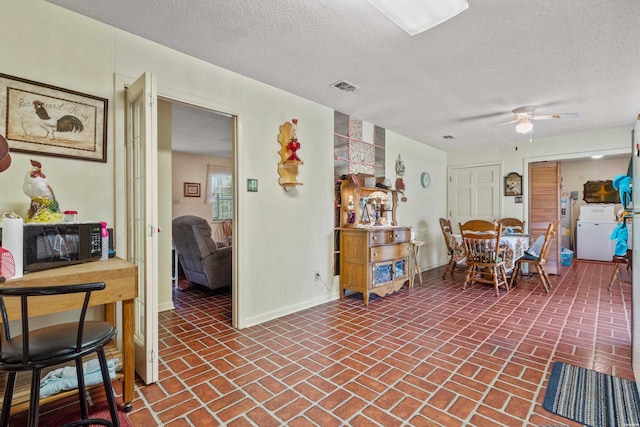 102 Avalon Dr, Pearcy, AR 71964 - dining room with brick flooring, a textured ceiling, and ceiling fan