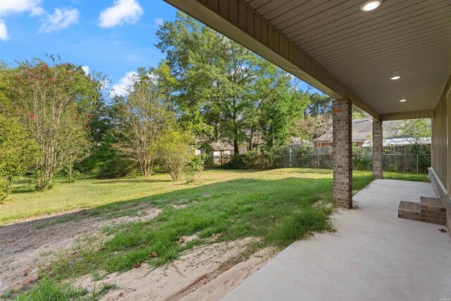 view of yard featuring a patio and fence