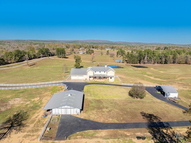 birds eye view of property with a rural view