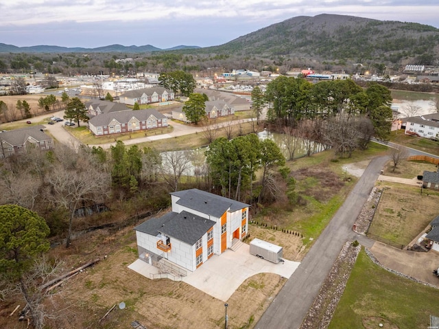 birds eye view of property featuring a mountain view and a residential view