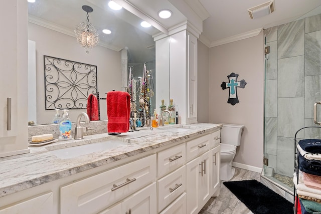 bathroom with a sink, toilet, and crown molding