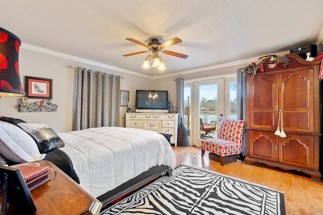 bedroom with access to exterior, a textured ceiling, light wood finished floors, and crown molding