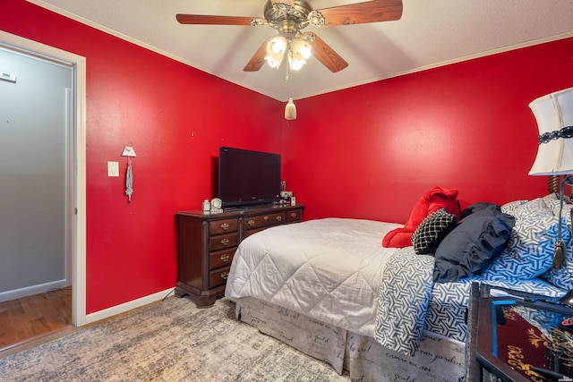 bedroom featuring baseboards and a ceiling fan