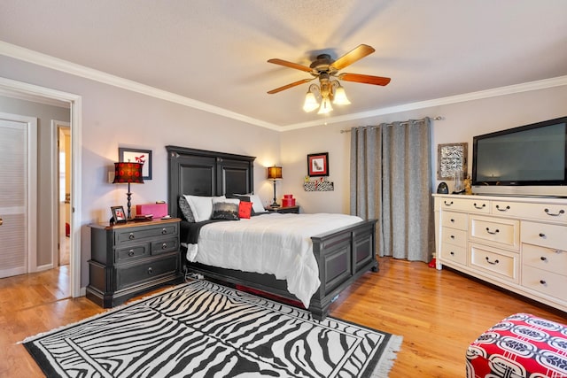 bedroom featuring ornamental molding and light wood-style flooring